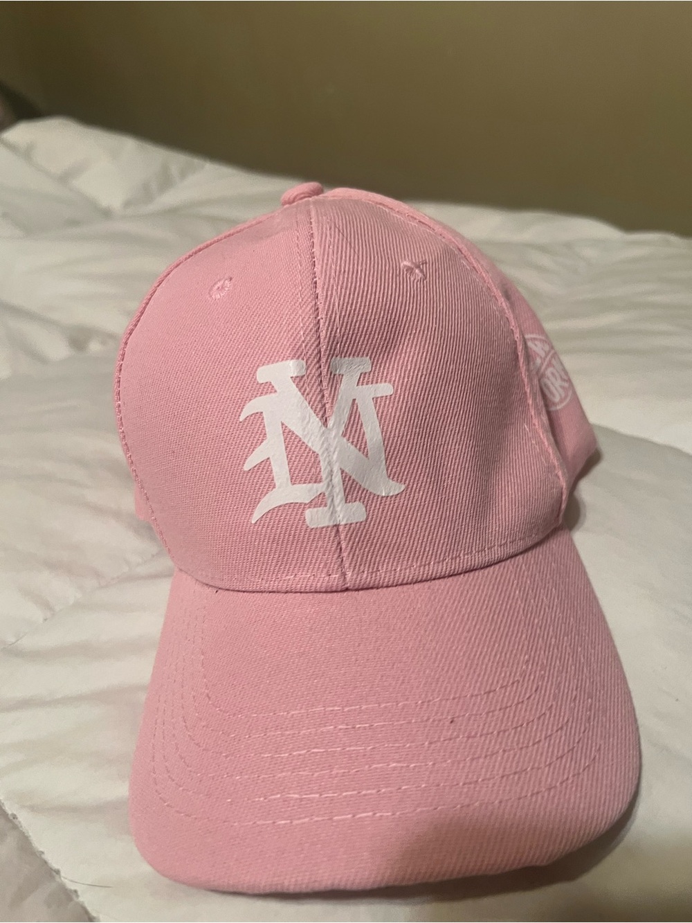 Unlisted Pink Baseball Cap with White Logo